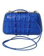 Bolsa Balenciaga azul em pele exótica, modelo clutch de ombro a tiracolo.