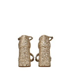 Sandálias de plataforma em plástico dourado da Miu Miu